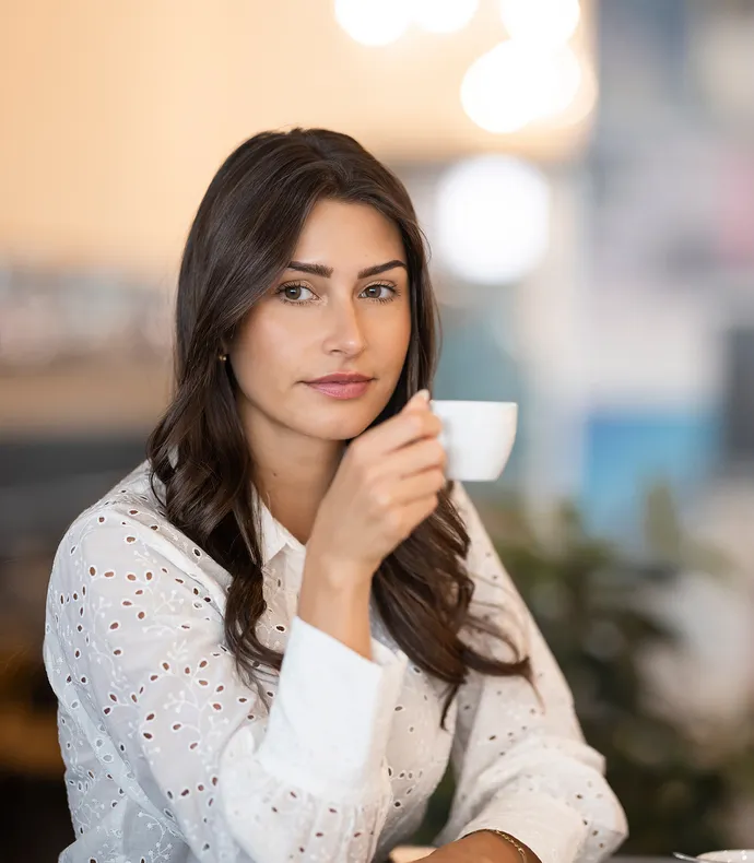 Woman enjoying coffee – Coffee culture and pleasure Alps Coffee